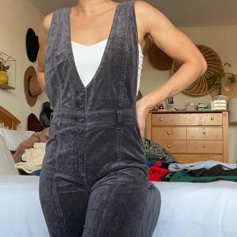 Velvet Button Up Jumpsuit with Suspender Straps from Anthropologie.